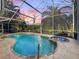 Relaxing pool and spa area with screened enclosure at 3117 Silkwood Ln, Port Charlotte, FL 33953
