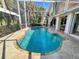 Freeform swimming pool with a screened enclosure at 3117 Silkwood Ln, Port Charlotte, FL 33953