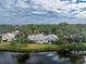 Aerial view showcasing backyard and canal at 313 Pembroke Lane North # 195, Venice, FL 34293