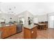 Spacious kitchen featuring wood cabinets, stainless steel appliances, and a tile floor at 32 Oakland Hills Ct, Rotonda West, FL 33947