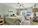 Spacious bedroom with a ceiling fan and plenty of natural light at 4036 Elvington Rd, Port Charlotte, FL 33981