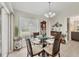 Inviting dining area with plenty of natural light from large window at 4036 Elvington Rd, Port Charlotte, FL 33981