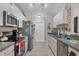 Modern kitchen with stainless steel appliances and grey countertops at 4036 Elvington Rd, Port Charlotte, FL 33981