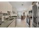 Bright kitchen next to dining area with stainless appliances and functional design at 4036 Elvington Rd, Port Charlotte, FL 33981