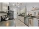 Efficient kitchen featuring stainless steel appliances and adjacent breakfast bar at 4036 Elvington Rd, Port Charlotte, FL 33981
