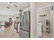Bright kitchen next to laundry room and open to dining area with natural light at 4036 Elvington Rd, Port Charlotte, FL 33981