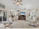 Spacious living room featuring ceiling fan, coastal decor, and comfortable seating at 4036 Elvington Rd, Port Charlotte, FL 33981