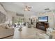 Bright living room featuring vaulted ceilings, neutral decor, and sliding doors to outdoor space at 4036 Elvington Rd, Port Charlotte, FL 33981