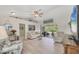 Bright living room featuring vaulted ceilings, neutral decor, and sliding doors to outdoor space at 4036 Elvington Rd, Port Charlotte, FL 33981