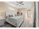 Comfortable bedroom with a queen-size bed and plenty of natural light at 455 Firethorn Ave, Englewood, FL 34223