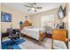 Cozy bedroom with a double bed and a built-in dresser at 455 Firethorn Ave, Englewood, FL 34223