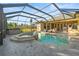 Spacious screened pool and spa area, perfect for entertaining at 455 Firethorn Ave, Englewood, FL 34223