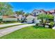 Two-story house with attached garage and lush landscaping at 4604 Club Dr # B201, Port Charlotte, FL 33953