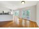 Bright dining room with hardwood floors and sliding glass doors leading to a patio at 4865 Lorri Cir, North Port, FL 34286