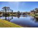 Community features a tranquil lake and lush landscaping at 520 Pine Hollow Cir # 520, Englewood, FL 34223