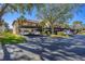 Condo complex with carport parking and lush landscaping at 520 Pine Hollow Cir # 520, Englewood, FL 34223