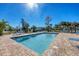 Sparkling community pool and relaxing patio area at 520 Pine Hollow Cir # 520, Englewood, FL 34223