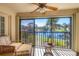 Relaxing sunroom overlooking a serene lake view at 520 Pine Hollow Cir # 520, Englewood, FL 34223