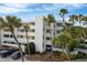 Condo building with lush landscaping and parking at 5700 Gulf Shores Dr # A224, Boca Grande, FL 33921