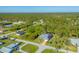 Aerial view of a single-Gathering home with a large backyard and canal at 6096 Bowie Ln, Englewood, FL 34224