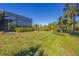 Landscaped backyard with lush greenery at 6096 Bowie Ln, Englewood, FL 34224