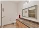 Clean bathroom with granite countertop and large mirror at 6096 Bowie Ln, Englewood, FL 34224