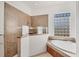 Spa-like bathroom with walk-in shower and soaking tub at 6096 Bowie Ln, Englewood, FL 34224