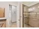 Bathroom with walk-in shower and access to another room at 6096 Bowie Ln, Englewood, FL 34224