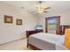 Bright bedroom with a double bed, dresser, and window with curtains at 6096 Bowie Ln, Englewood, FL 34224
