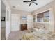 Bedroom with built-in shelving, a double bed, and a couch at 6096 Bowie Ln, Englewood, FL 34224