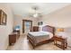 Bedroom with a queen-size bed and plenty of storage space at 6096 Bowie Ln, Englewood, FL 34224