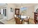 Bright dining area with wood table and chairs, near kitchen at 6096 Bowie Ln, Englewood, FL 34224