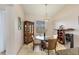 Charming dining area with a round glass table and four chairs at 6096 Bowie Ln, Englewood, FL 34224