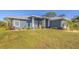 Single-story home with a metal roof and a modern design at 6096 Bowie Ln, Englewood, FL 34224