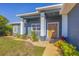Modern home exterior with a double door entry at 6096 Bowie Ln, Englewood, FL 34224