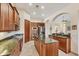 Island kitchen with stainless steel appliances and granite countertops at 6096 Bowie Ln, Englewood, FL 34224