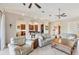Open living room with a view into the kitchen and access to other rooms at 6096 Bowie Ln, Englewood, FL 34224