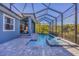 Inviting pool and spa area with a screened enclosure at 6096 Bowie Ln, Englewood, FL 34224