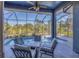 Screened pool area with seating and a fire pit table at 6096 Bowie Ln, Englewood, FL 34224