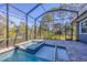 Relaxing spa and pool with a screened enclosure at 6096 Bowie Ln, Englewood, FL 34224
