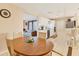 Bright dining area with an oval table and chairs near the kitchen and living room at 6358 Granger Rd, Port Charlotte, FL 33981