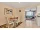 Cozy dining area adjacent to the kitchen and living room, perfect for casual meals and gatherings at 6358 Granger Rd, Port Charlotte, FL 33981