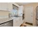Bright kitchen with white cabinets, stainless steel appliances, and marble countertops at 6358 Granger Rd, Port Charlotte, FL 33981