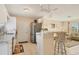 Kitchen with white cabinets, stainless steel appliances, and breakfast bar at 6358 Granger Rd, Port Charlotte, FL 33981