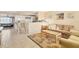 Spacious living area with breakfast bar and comfortable seating, creating an ideal entertaining space at 6358 Granger Rd, Port Charlotte, FL 33981