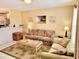 Cozy living room with tile flooring, comfortable seating, and stylish decor, perfect for relaxation at 6358 Granger Rd, Port Charlotte, FL 33981
