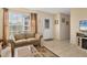 Living room with sofa, love seat, and tiled floors at 6358 Granger Rd, Port Charlotte, FL 33981