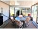 Enclosed patio area with a dining set for six and a grill at 6358 Granger Rd, Port Charlotte, FL 33981
