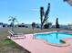Backyard pool area with lounge chairs and well-maintained landscaping at 6358 Granger Rd, Port Charlotte, FL 33981