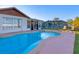Enjoy this sparkling pool with adjacent lounge chairs at 6358 Granger Rd, Port Charlotte, FL 33981